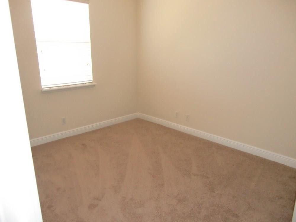 2691 Southwest 99th Way, Unit 2691 Miramar, FL 33025 - Photo 11 of 17 an empty room with a window