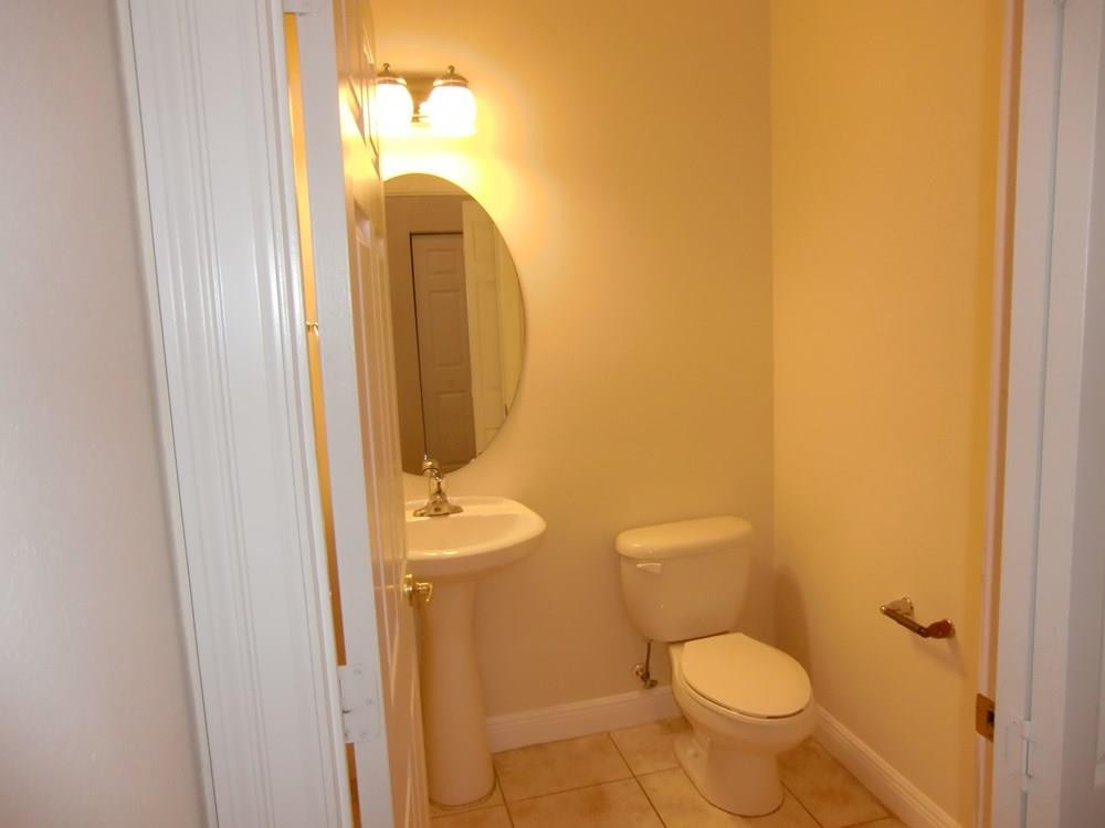 2691 Southwest 99th Way, Unit 2691 Miramar, FL 33025 - Photo 13 of 17 a bathroom with a toilet and a sink