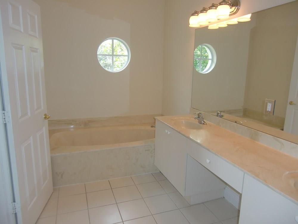 2691 Southwest 99th Way, Unit 2691 Miramar, FL 33025 - Photo 14 of 17 a bathroom with a sink a toilet and a bathtub