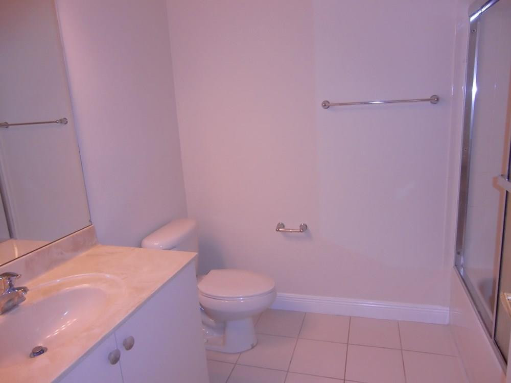 2691 Southwest 99th Way, Unit 2691 Miramar, FL 33025 - Photo 16 of 17 a bathroom with a sink a toilet and shower