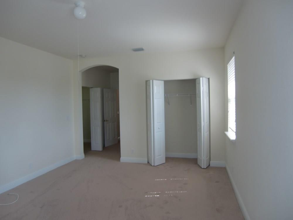 2691 Southwest 99th Way, Unit 2691 Miramar, FL 33025 - Photo 7 of 17 an empty room with closet and a bathroom