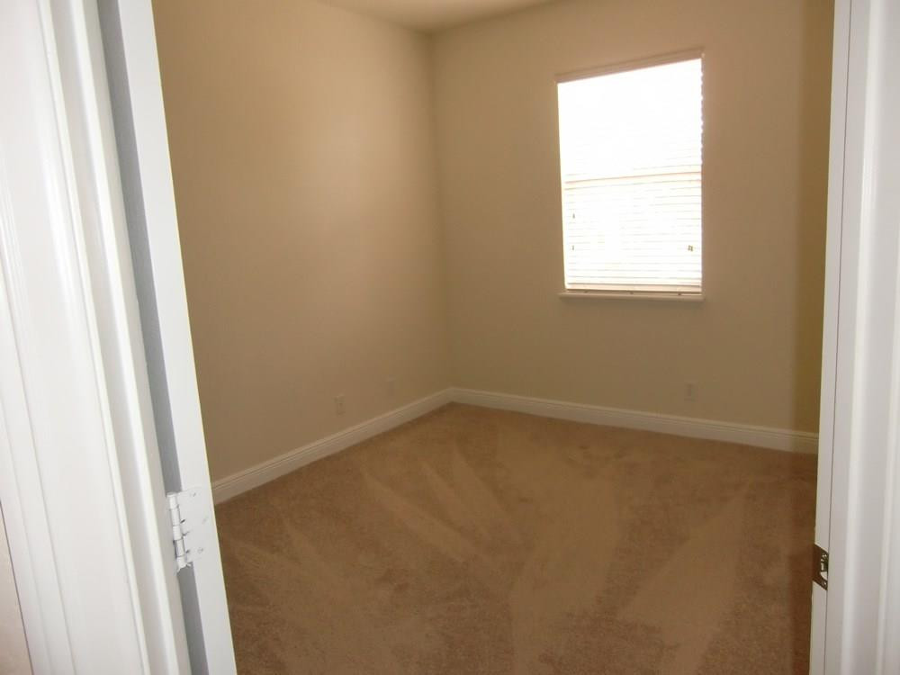 2691 Southwest 99th Way, Unit 2691 Miramar, FL 33025 - Photo 10 of 17 an empty room with a window
