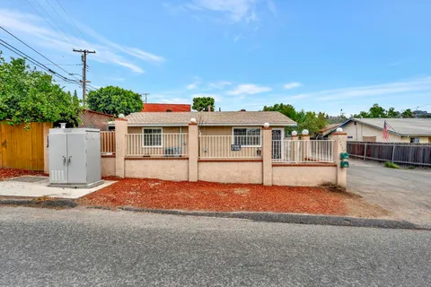a house with swimming pool in front of it