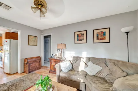 a kitchen with stainless steel appliances granite countertop a sink and cabinets
