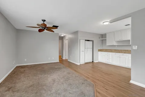 a view of an empty room with a window