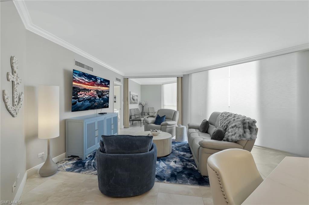 730 South Collier Boulevard, Unit 1303 Marco Island, FL 34145 - Photo 15 of 26 a living room with furniture and a flat screen tv