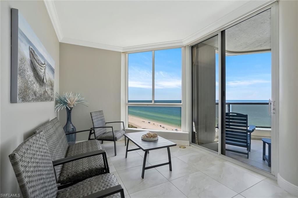 730 South Collier Boulevard, Unit 1303 Marco Island, FL 34145 - Photo 8 of 26 a living room with furniture and a window