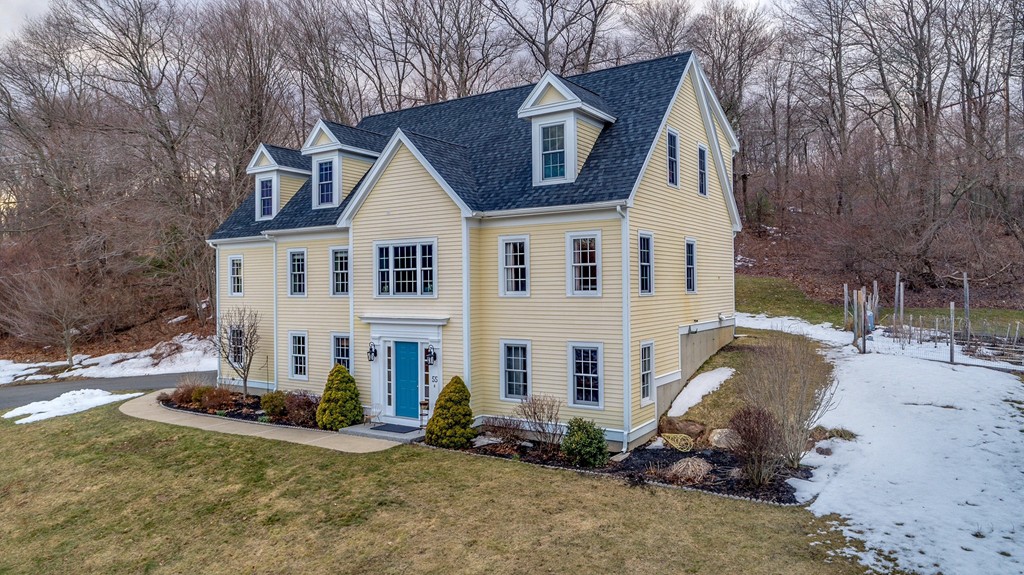 55 Glendale Road Boxford, MA 01921 - Photo 1 of 29 a view of a white house with a yard and large trees
