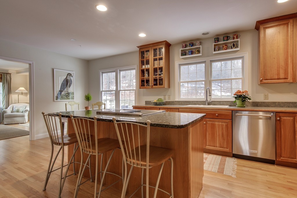 55 Glendale Road Boxford, MA 01921 - Photo 5 of 29 a dining hall with stainless steel appliances a table and chairs