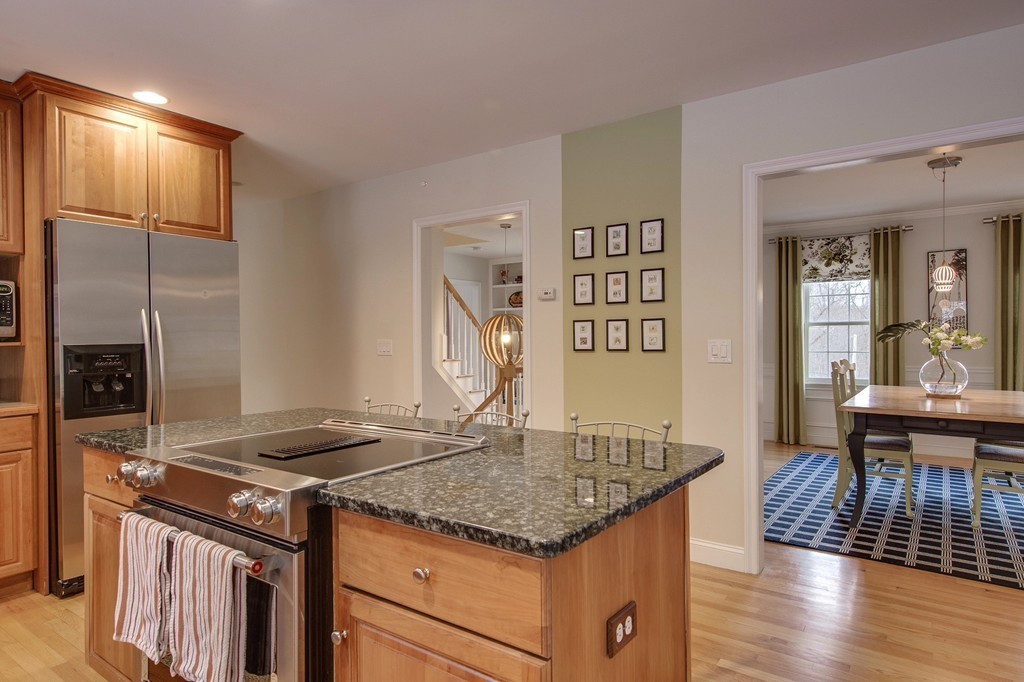 55 Glendale Road Boxford, MA 01921 - Photo 7 of 29 a kitchen that has a microwave a stove and wooden floor