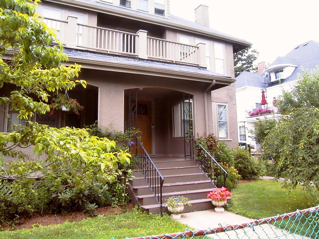 a front view of a house with garden