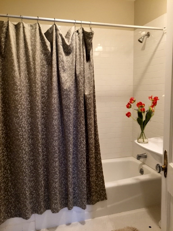 90 Orchard Street, Unit 1 Boston, MA 02130 - Photo 10 of 10 a bathroom with a shower and a bathtub