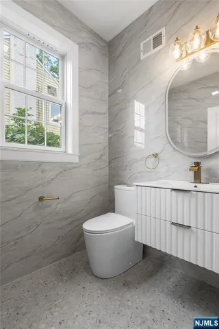 a bathroom with a toilet and a sink