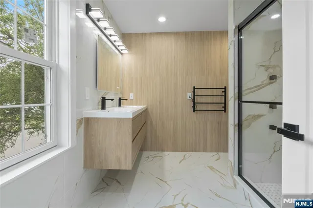 a bathroom with a bathtub and a sink