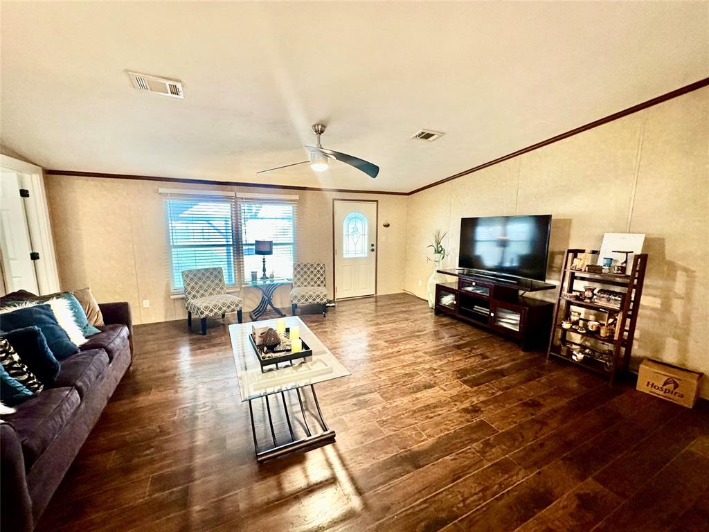 219 County Road 2723 Decatur, TX 76234 - Photo 13 of 26 a living room with furniture and a flat screen tv