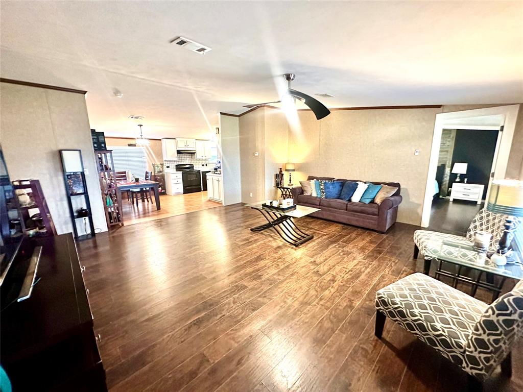 219 County Road 2723 Decatur, TX 76234 - Photo 18 of 26 a living room with furniture and wooden floor