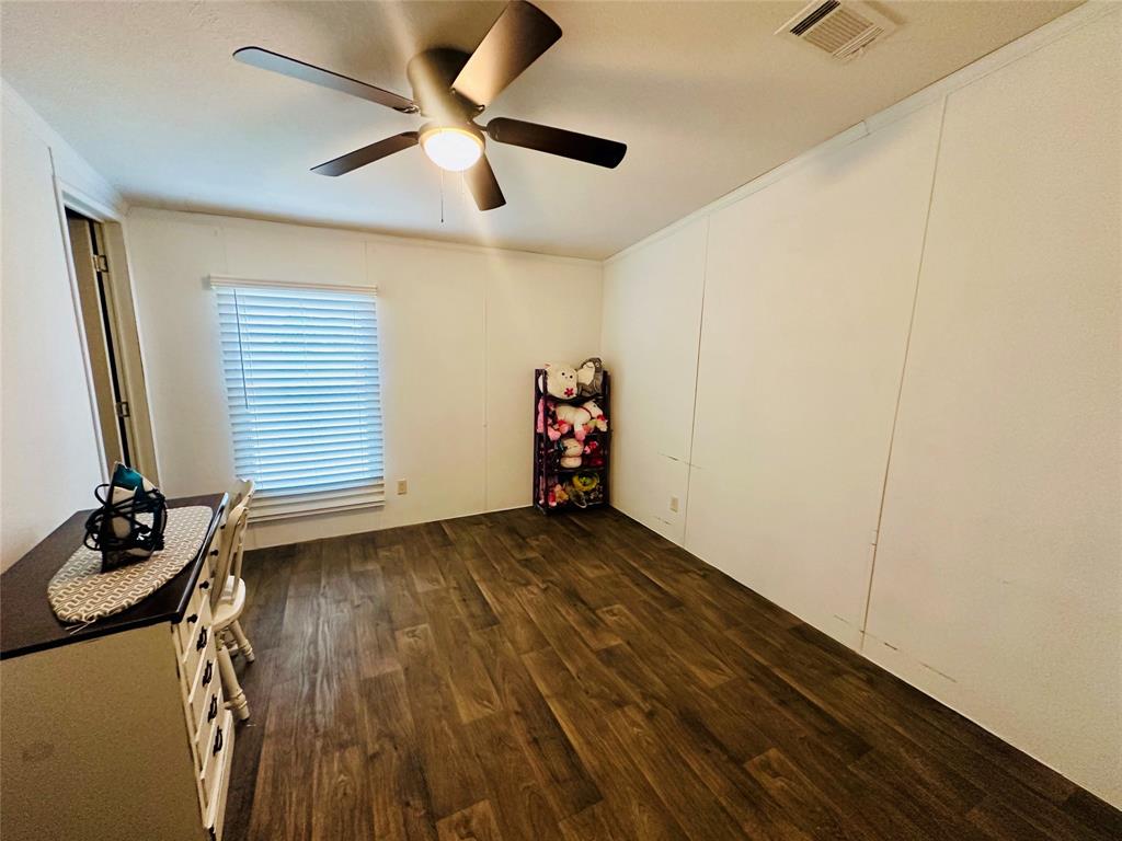 219 County Road 2723 Decatur, TX 76234 - Photo 22 of 26 a view of empty room with wooden floor