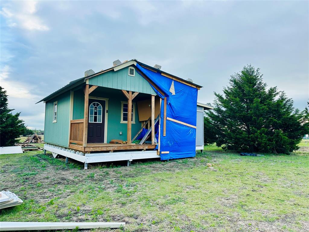219 County Road 2723 Decatur, TX 76234 - Photo 25 of 26 front view of a house with a yard