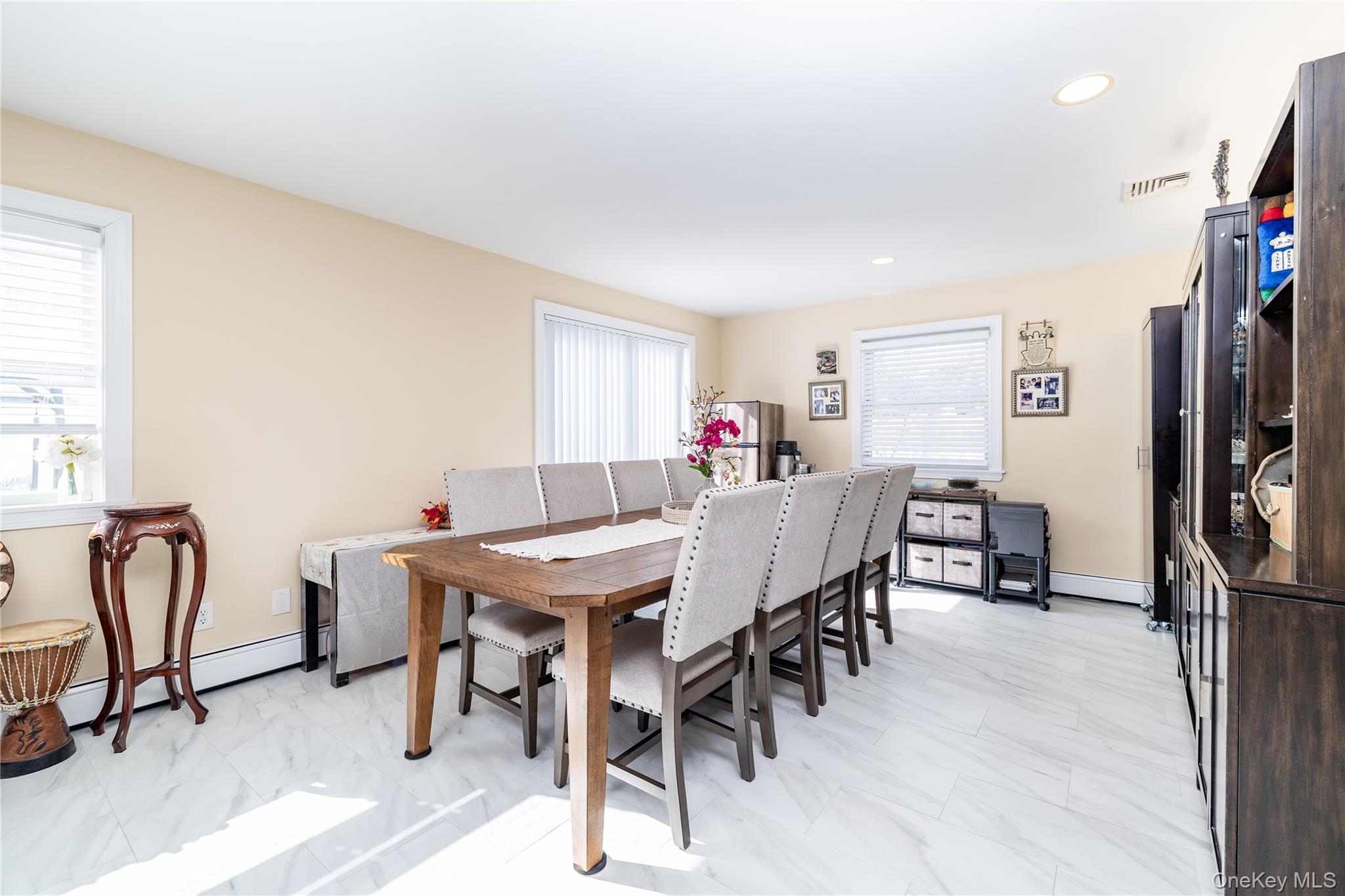 458 East Pine Street Long Beach, NY 11561 - Photo 13 of 26 a view of a dining room with furniture and a window