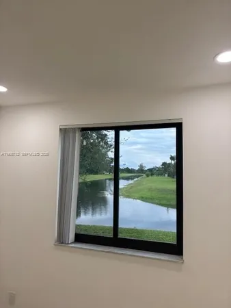 a view of a room that has a large window