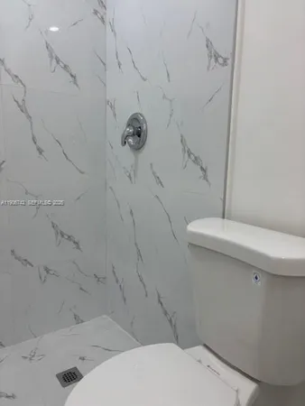 a bathroom with a sink and toilet