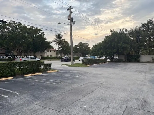 a view of street with parked cars