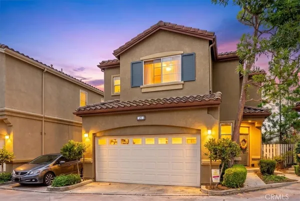 a front view of a house with a garage