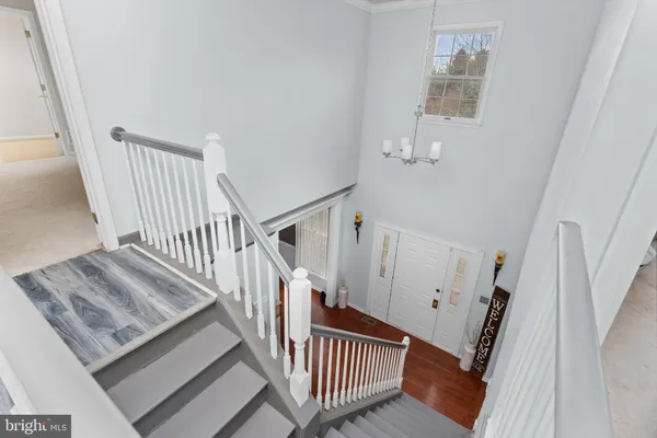 a view of entryway with stairs and wooden floor