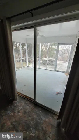 a view of a windows and an entryway in a room