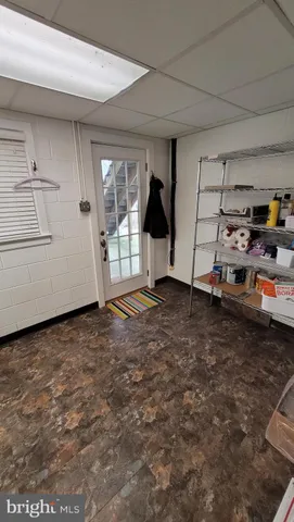 a view of a house with snow on the road