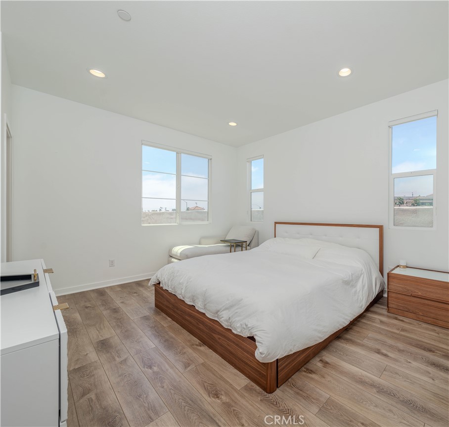 329 Ford Road Costa Mesa, CA 92627 - Photo 4 of 5 a large bed sitting in a bedroom next to a window