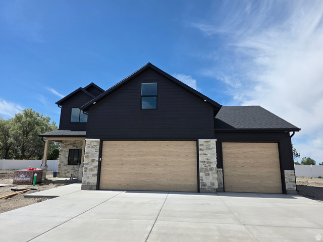 1267 West 2350 South Perry, UT 84302 - Photo 1 of 20 Contemporary exterior featuring dark siding and stone accents