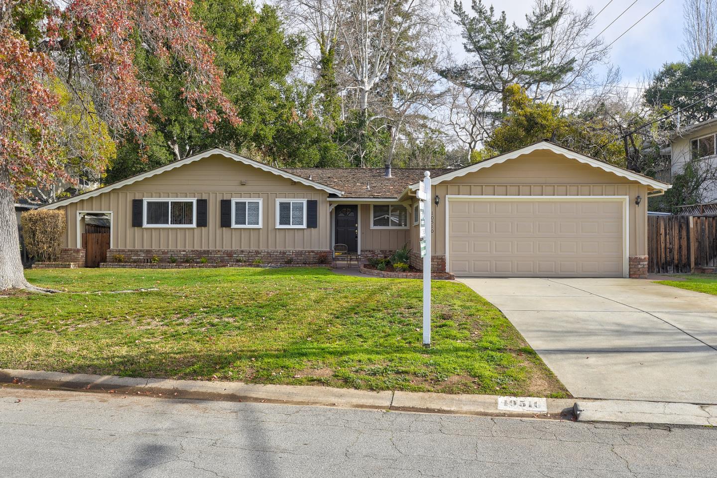 10510 Creston Drive Los Altos, CA 94024 - Photo 2 of 25 a front view of a house with a yard