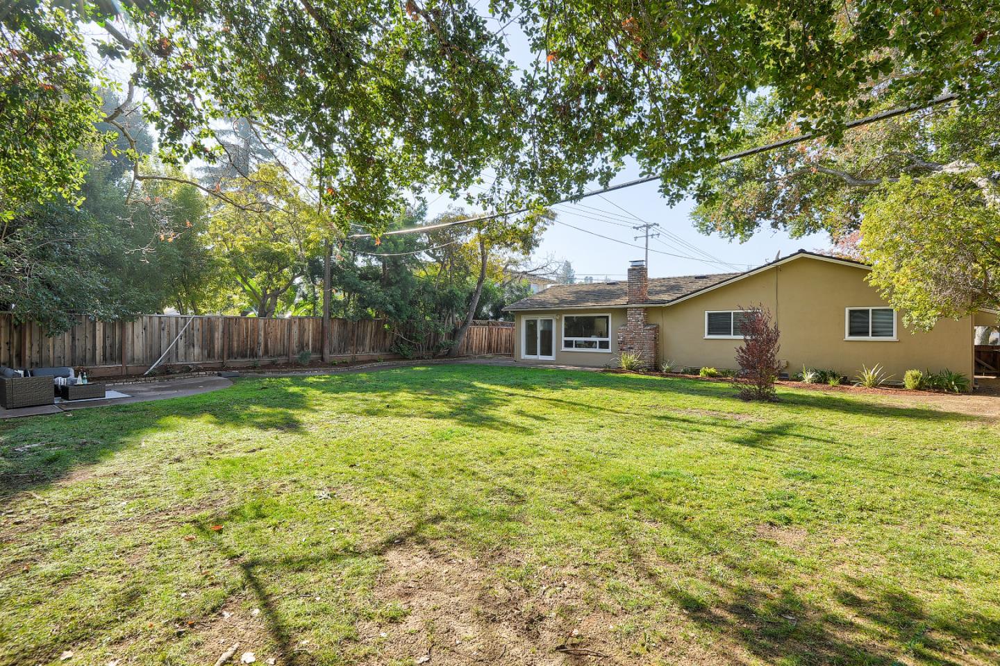 10510 Creston Drive Los Altos, CA 94024 - Photo 22 of 25 a front view of house with yard and seating area