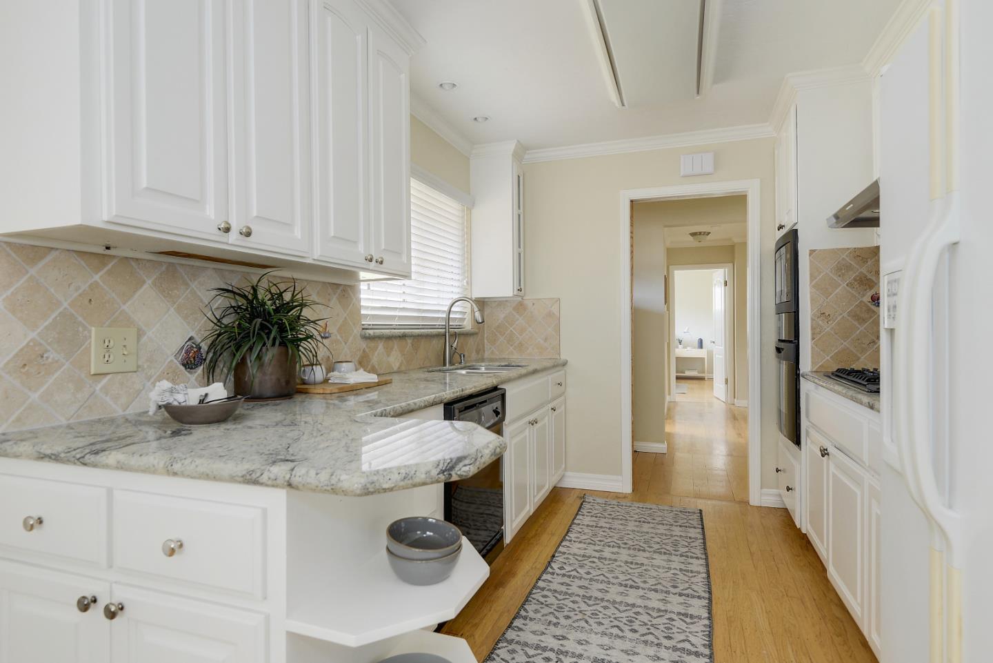 10510 Creston Drive Los Altos, CA 94024 - Photo 5 of 25 a kitchen with sink and refrigerator