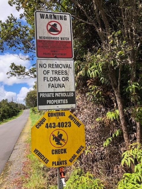 1479 Volcano Road Pahoa, HI 96778 - Photo 7 of 13 a sign that is sitting on a brick wall