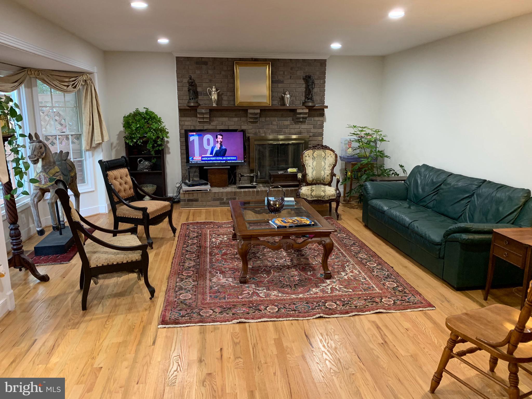 54 Rutherford Circle Sterling, VA 20165 - Photo 12 of 58 MAIN LEVEL FAMILY ROOM WITH FIREPLACE & BAY WINDOW