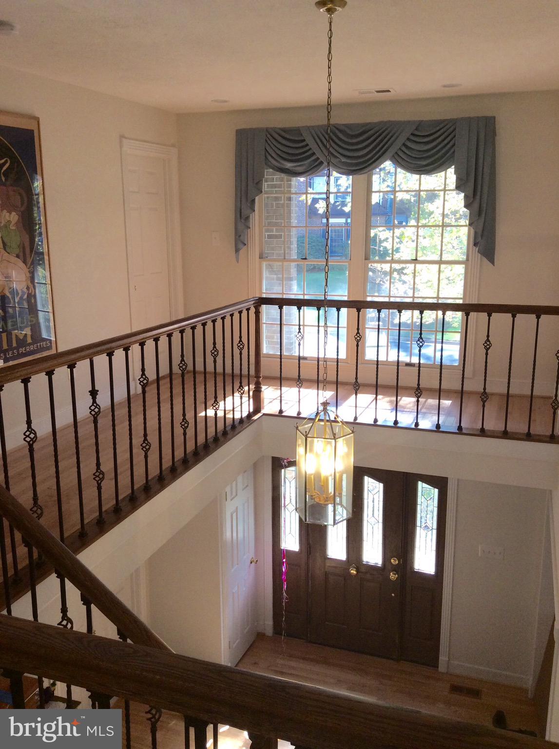54 Rutherford Circle Sterling, VA 20165 - Photo 17 of 58 VIEW TO ENTRY FOYER FROM UPPER LEVEL BALCONY