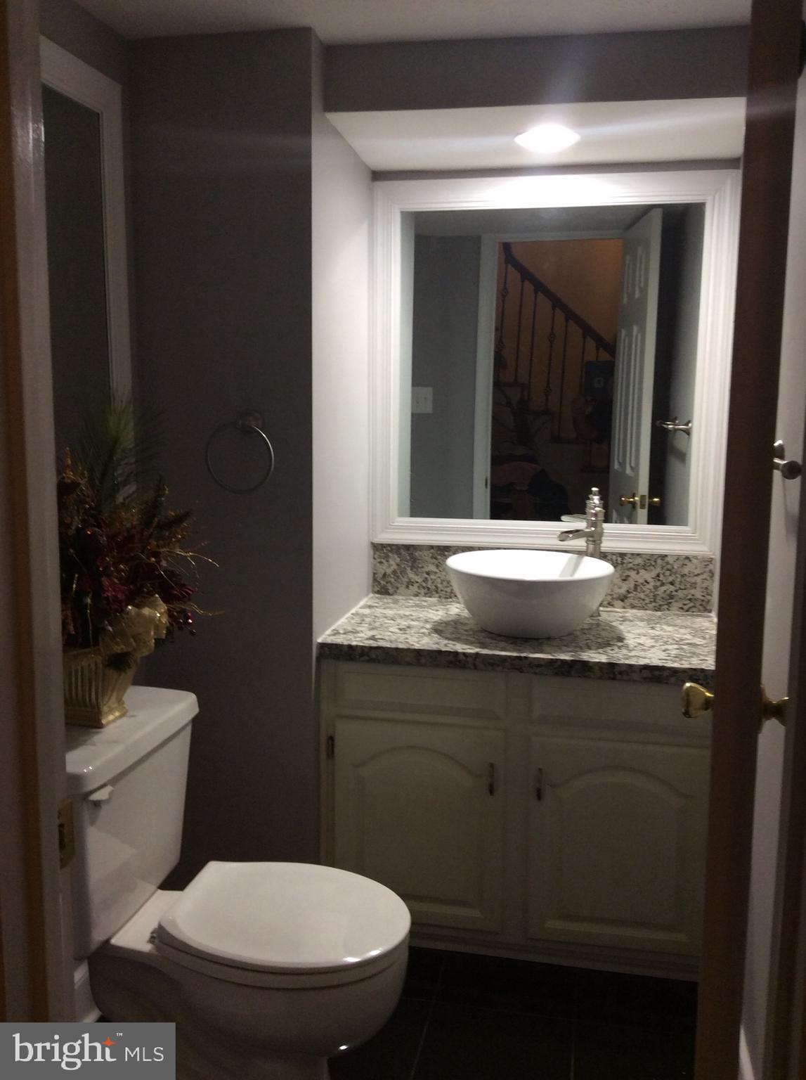 54 Rutherford Circle Sterling, VA 20165 - Photo 38 of 58 POWDER ROOM WITH VESSEL SINK & WATERFALL SPOUT