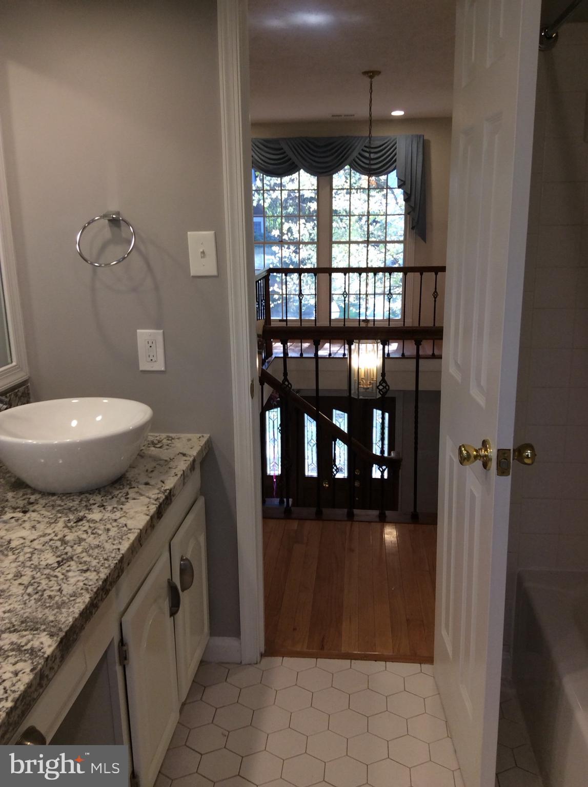 54 Rutherford Circle Sterling, VA 20165 - Photo 52 of 58 BATHROOM 2 VIEW TO BALCONY