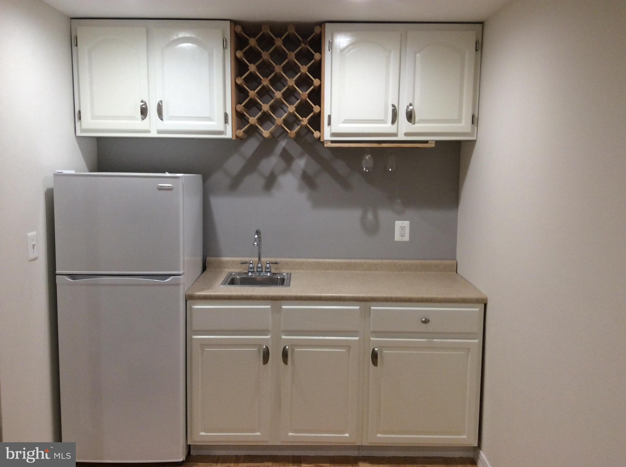 54 Rutherford Circle Sterling, VA 20165 - Photo 53 of 58 WET BAR ON LOWER LEVEL