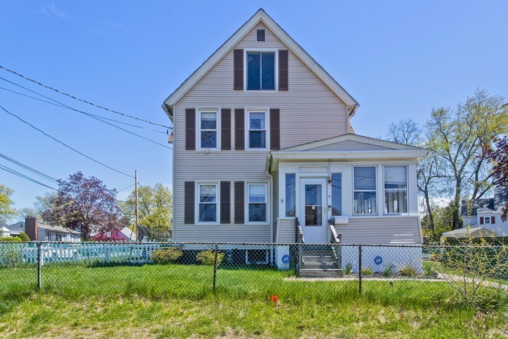 4 Laurel Street Chicopee, MA 01020 - Photo 1 of 35 a front view of a house with a yard