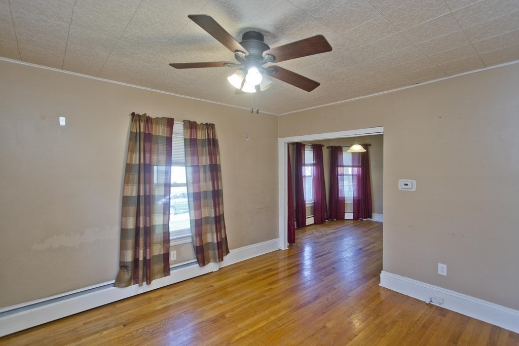 4 Laurel Street Chicopee, MA 01020 - Photo 11 of 35 a view of an empty room with wooden floor and a window