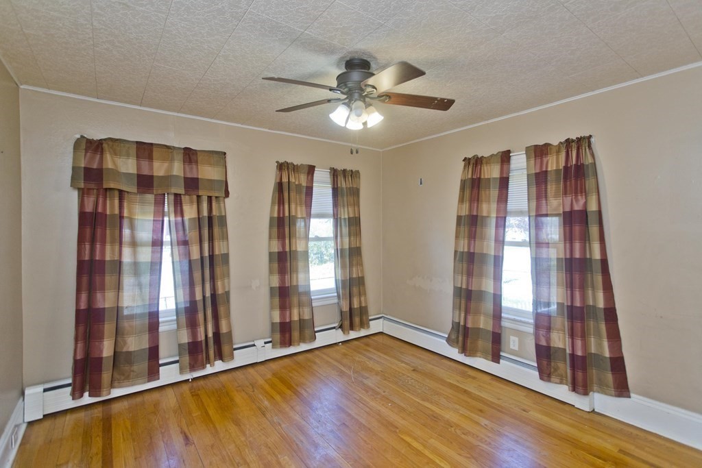 4 Laurel Street Chicopee, MA 01020 - Photo 12 of 35 wooden floor in an empty room with a window