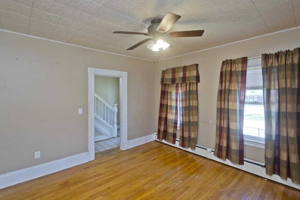 4 Laurel Street Chicopee, MA 01020 - Photo 13 of 35 wooden floor in an empty room with a window