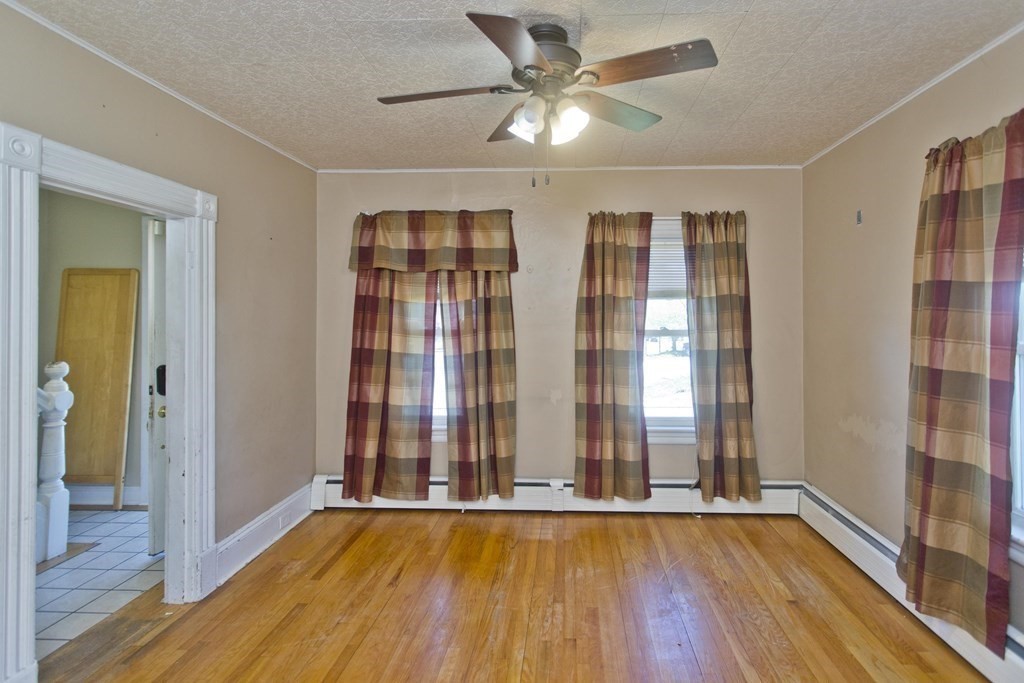4 Laurel Street Chicopee, MA 01020 - Photo 14 of 35 wooden floor in an empty room with a window
