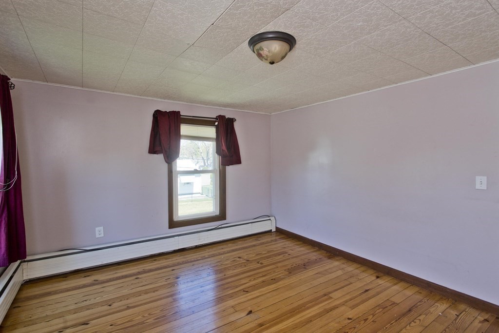 4 Laurel Street Chicopee, MA 01020 - Photo 17 of 35 a view of empty room with wooden floor and fan