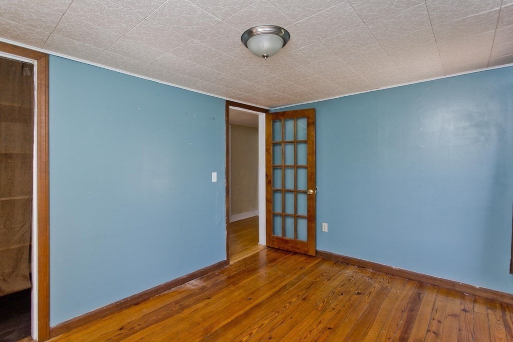 4 Laurel Street Chicopee, MA 01020 - Photo 20 of 35 a view of empty room with wooden floor and fan