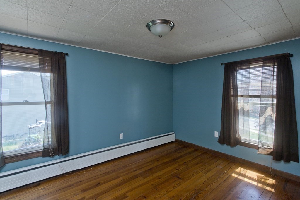4 Laurel Street Chicopee, MA 01020 - Photo 21 of 35 a view of empty room with wooden floor and fan