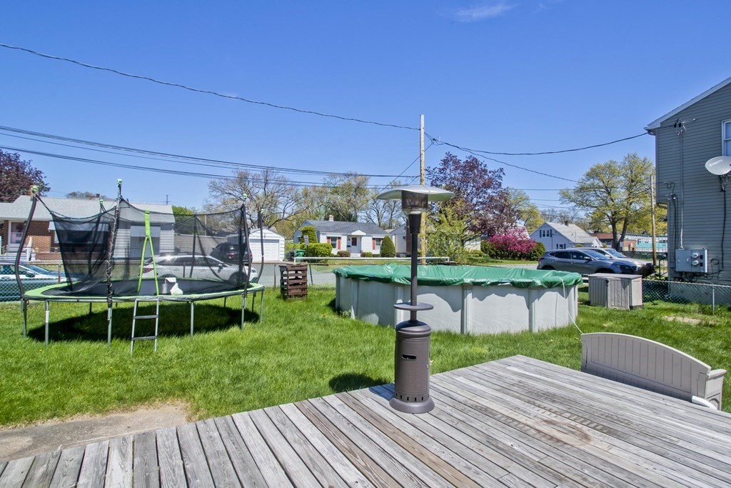 4 Laurel Street Chicopee, MA 01020 - Photo 31 of 35 a front view of a house with a yard table and chairs